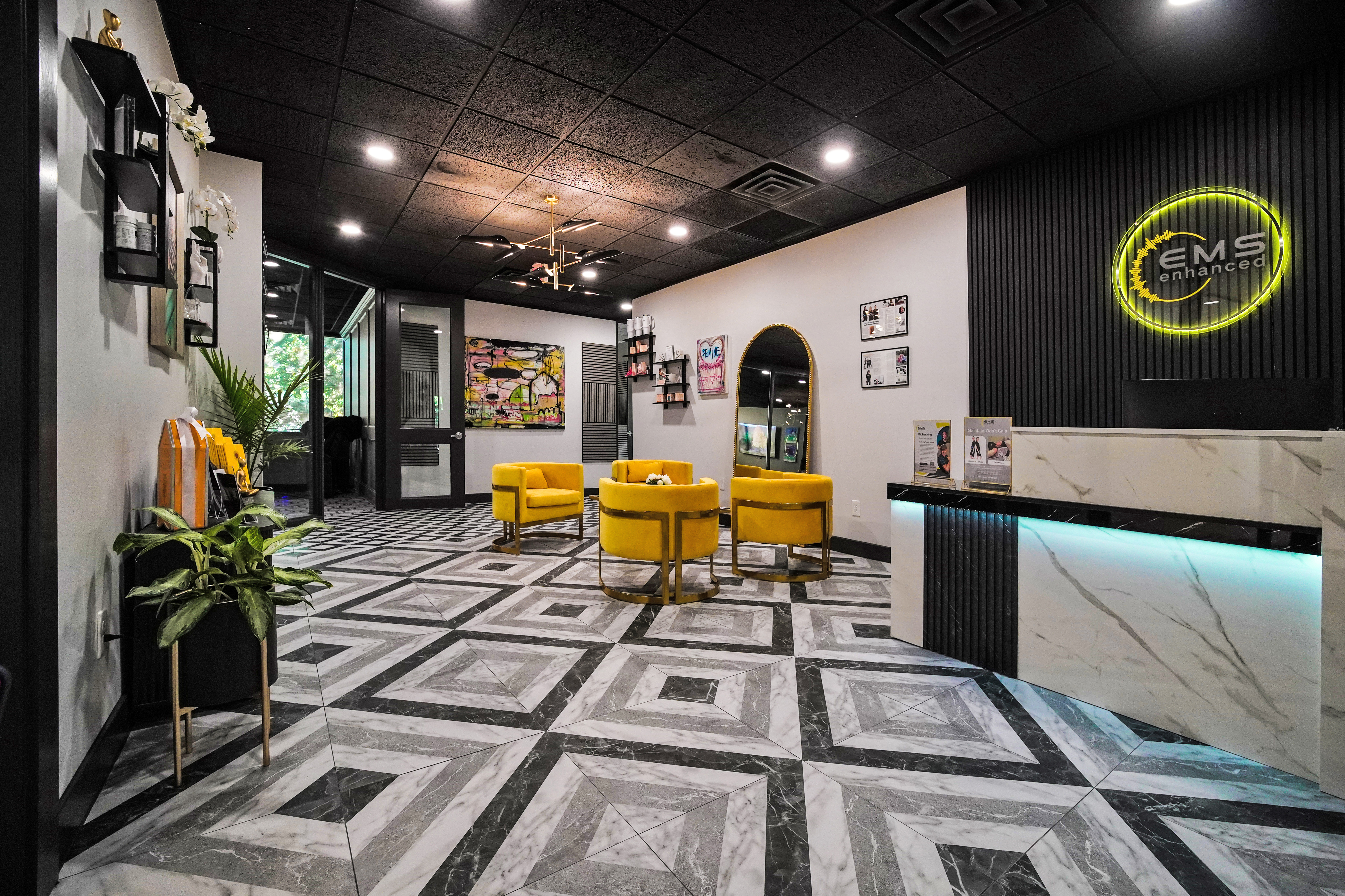 A woman wearing a full-body EMS training suit during a workout.